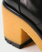 Homers Stiefeletten Absatz